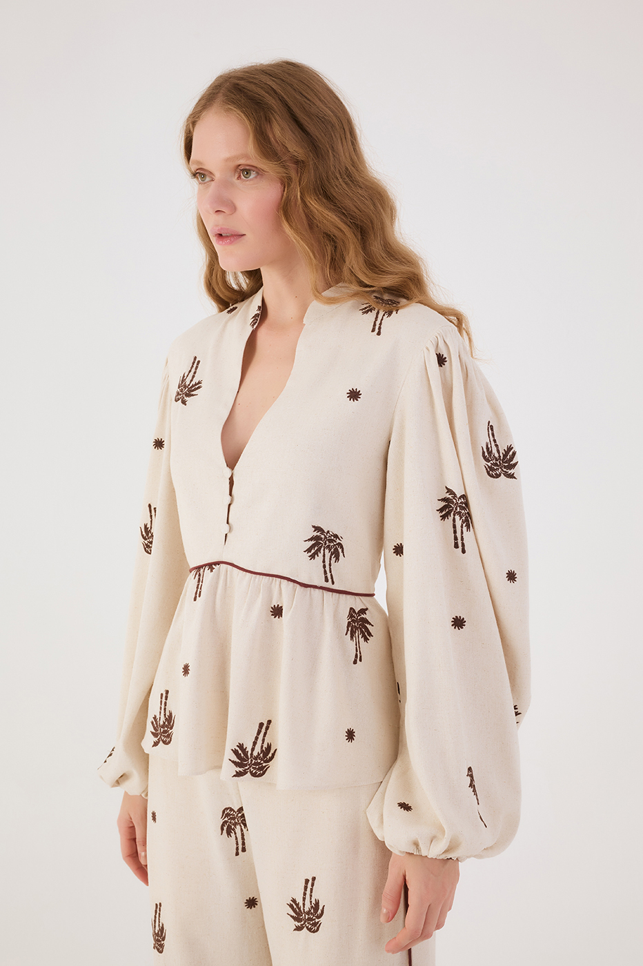 Off-White Sol Rio Embroidered V Neck Puff Sleeve Peplum Blouse
