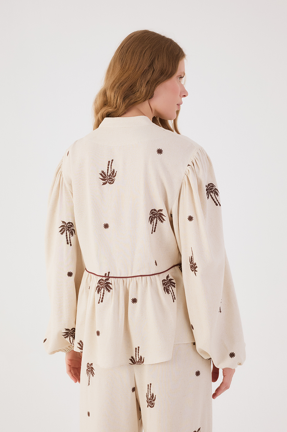 Off-White Sol Rio Embroidered V Neck Puff Sleeve Peplum Blouse