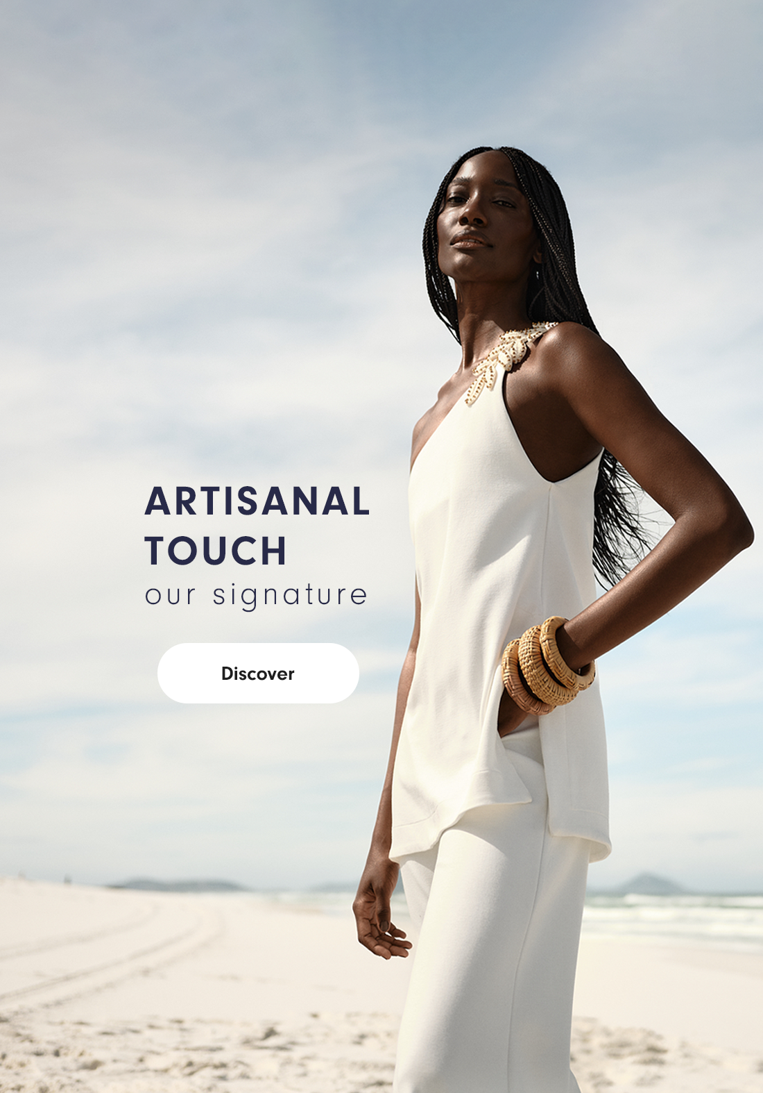 Woman in white outfit on the beach, Artisanal Touch collection banner – mobile version