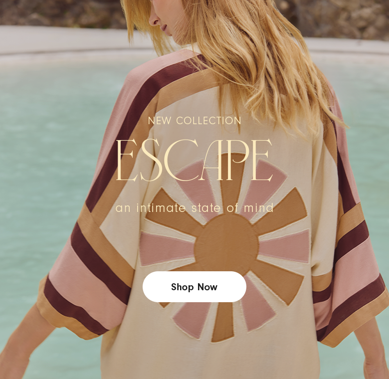 A woman is photographed from behind standing by a light blue pool, wearing a cream garment with wide sleeves in pink, beige, and brown stripes. On the back, there is a large embroidered sunburst motif in beige and soft pink tones. Centered over the image is the text “NEW COLLECTION” above the word “ESCAPE” in large serif letters, followed by the phrase “an intimate state of mind.”