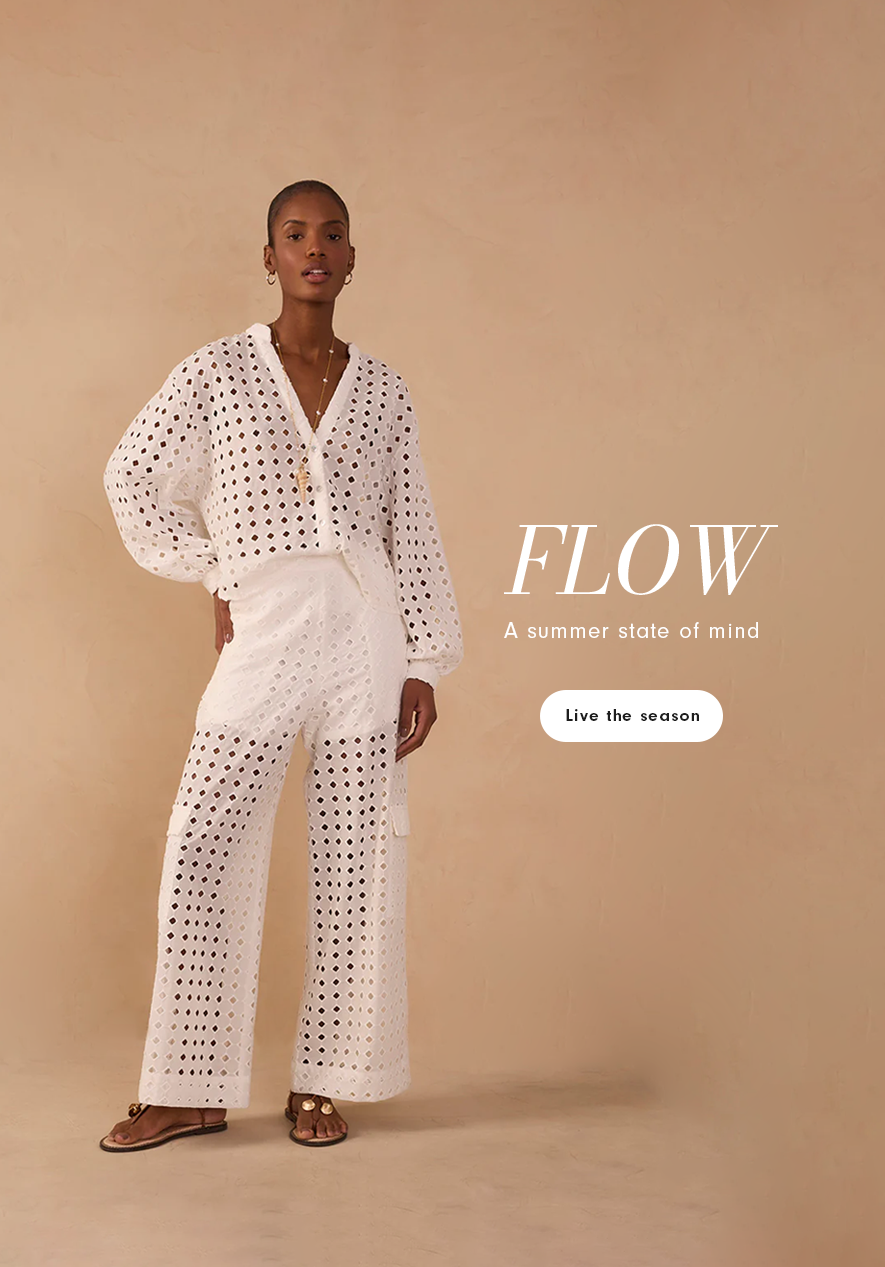 Mobile banner of a Black woman wearing a white eyelet broderie anglaise blouse and matching wide-leg pants, standing against a beige background. Text reads "Flow - A summer state of mind" with a "Live the season" button.