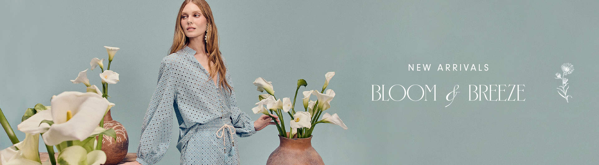 Wide Dress To Bloom and Breeze new arrivals collection banner featuring a model in a light blue dotted dress with white calla lilies against a sage green background