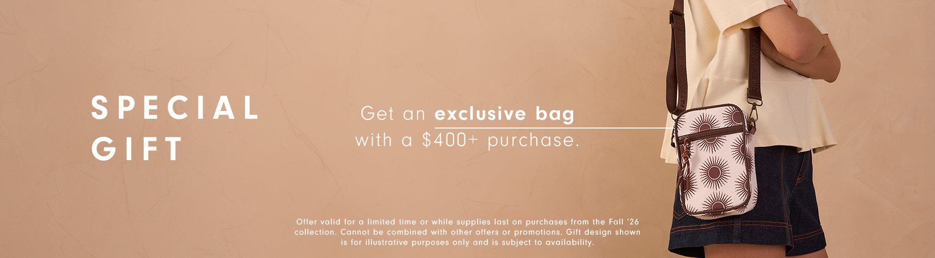 Special gift desktop banner: woman in a cream blouse and denim skirt with a sun-print crossbody bag, offering an exclusive bag with purchases over $400