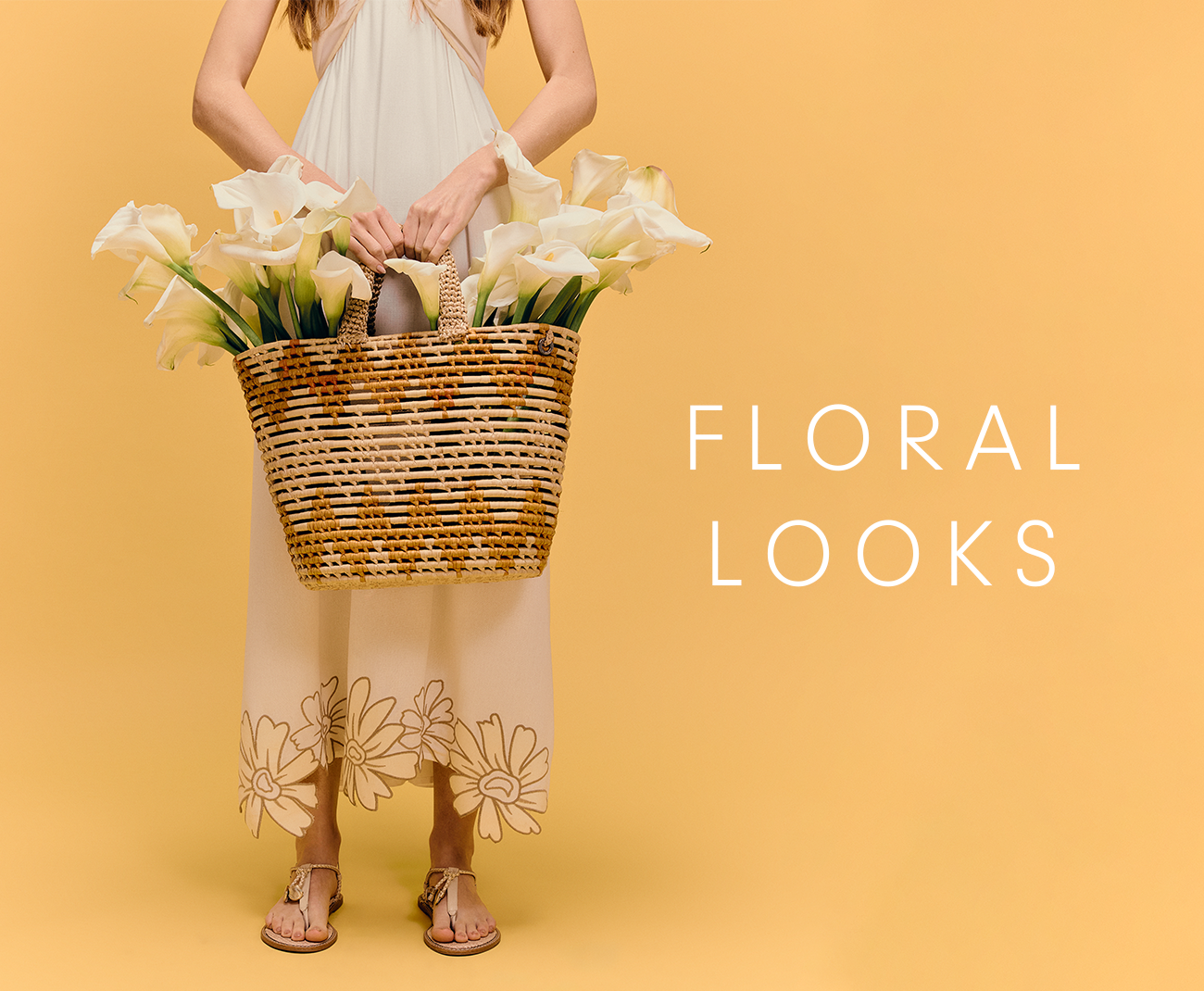 Dress To Floral Looks collection banner featuring a model in a white dress holding a basket of white calla lilies on a warm yellow background