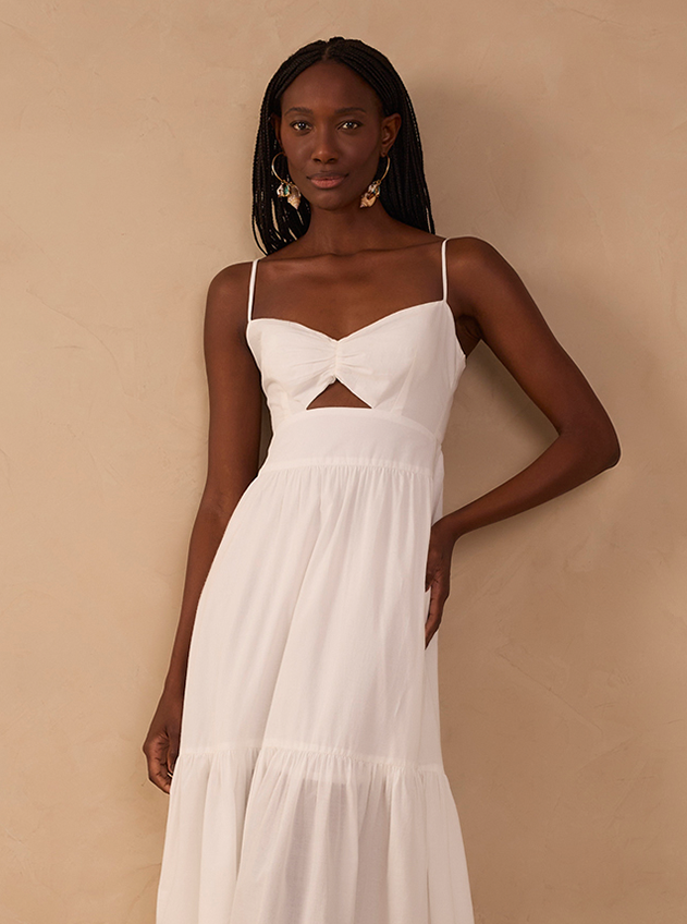 Model wearing white midi dress with front cutout and tiered skirt - size L fit reference