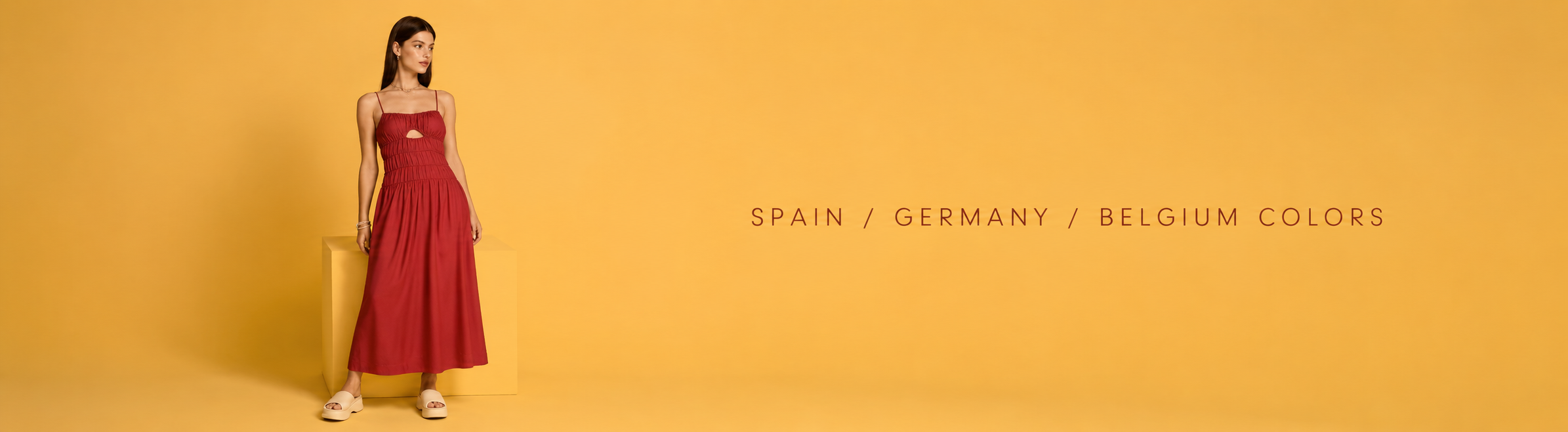 Woman in a red midi dress posing against a yellow background; banner reading Spain / Germany / Belgium colors