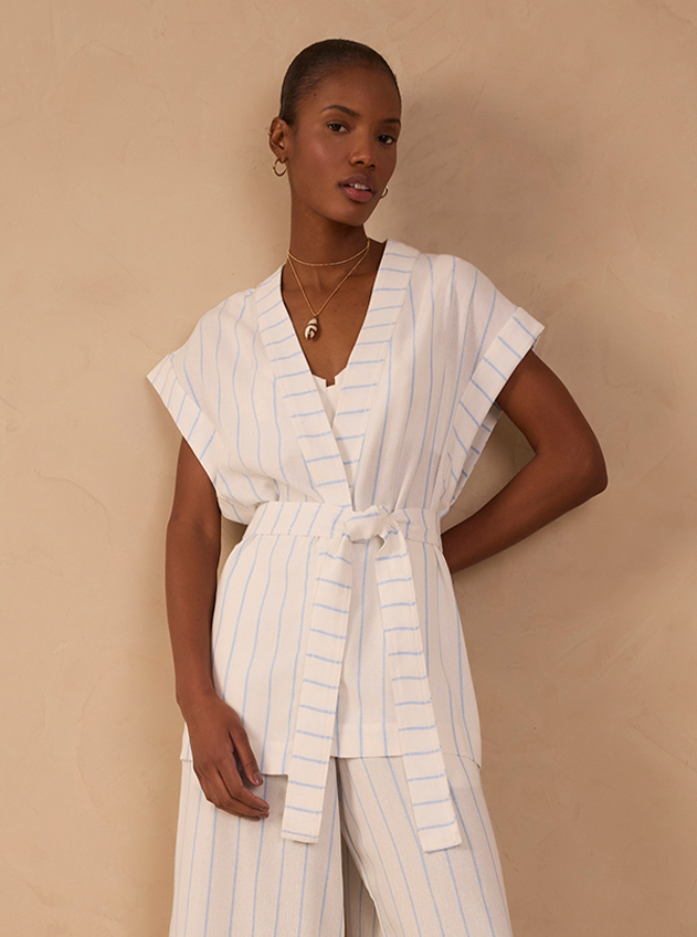 Model wearing white and blue striped wrap top with matching pants - size XL fit reference
