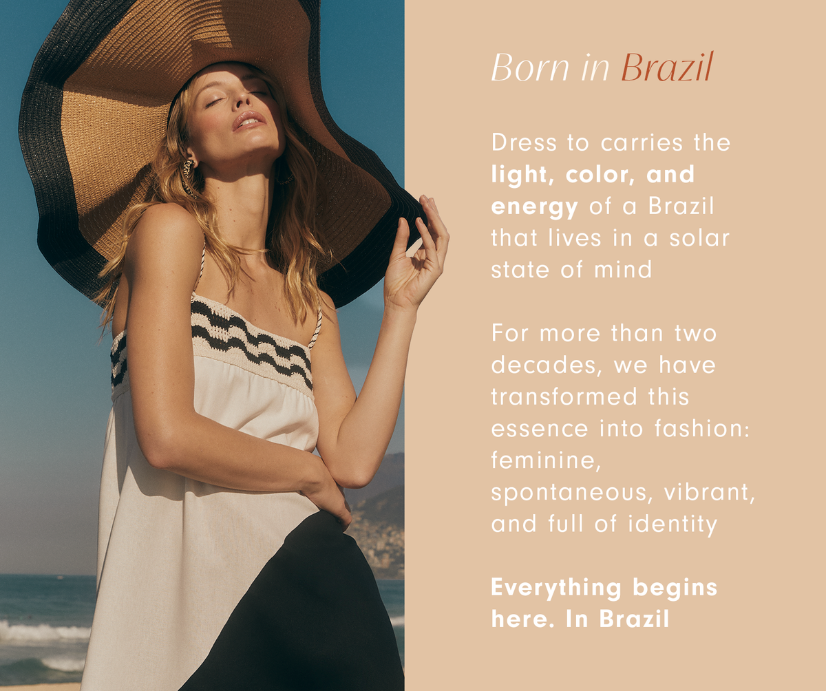 Woman in a wide-brim straw hat and cream striped top by the sea with text: Born in Brazil