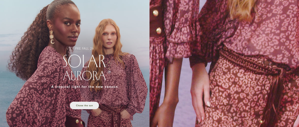 Dress To Pre Fall 26 Solar Aurora campaign video: two models wear a pink and burgundy leopard-print blouse with balloon sleeves and a braided belt against a soft sky and sea backdrop.